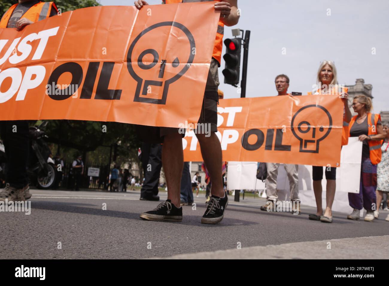 London, UK. 17/June/2023 Just Stop Oil Protests with a Slow March in Westinster. Campaign group Just Stop Oil held its weekly slow march from Parliament Square on Saturday. The march coincided with the royal birthday resulting in an increased police presence. After being threatened with arrests the group moved onto the kerb to continue its March. Credit: Roland Ravenhill/Alamy. Stock Photo