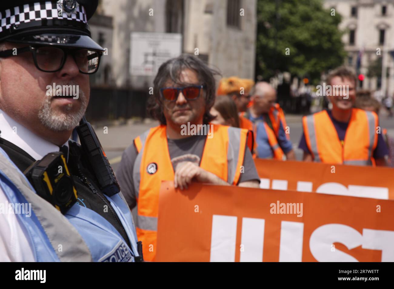 London, UK. 17/June/2023 Just Stop Oil Protests with a Slow March in Westinster. Campaign group Just Stop Oil held its weekly slow march from Parliament Square on Saturday. The march coincided with the royal birthday resulting in an increased police presence. After being threatened with arrests the group moved onto the kerb to continue its March. Credit: Roland Ravenhill/Alamy. Stock Photo