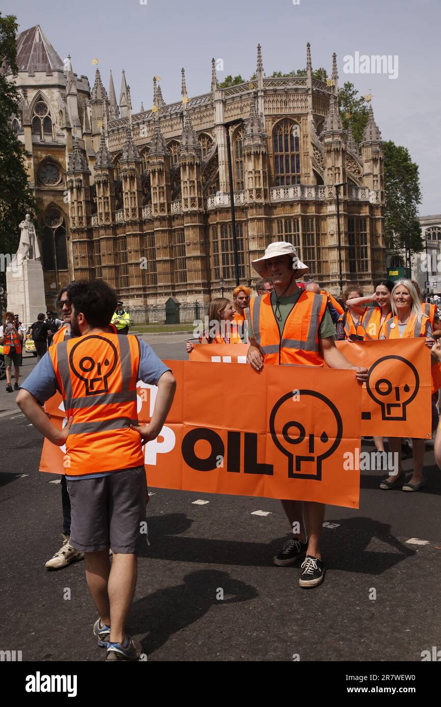 London, UK. 17/June/2023 Just Stop Oil Protests with a Slow March in Westinster. Campaign group Just Stop Oil held its weekly slow march from Parliament Square on Saturday. The march coincided with the royal birthday resulting in an increased police presence. After being threatened with arrests the group moved onto the kerb to continue its March. Credit: Roland Ravenhill/Alamy. Stock Photo