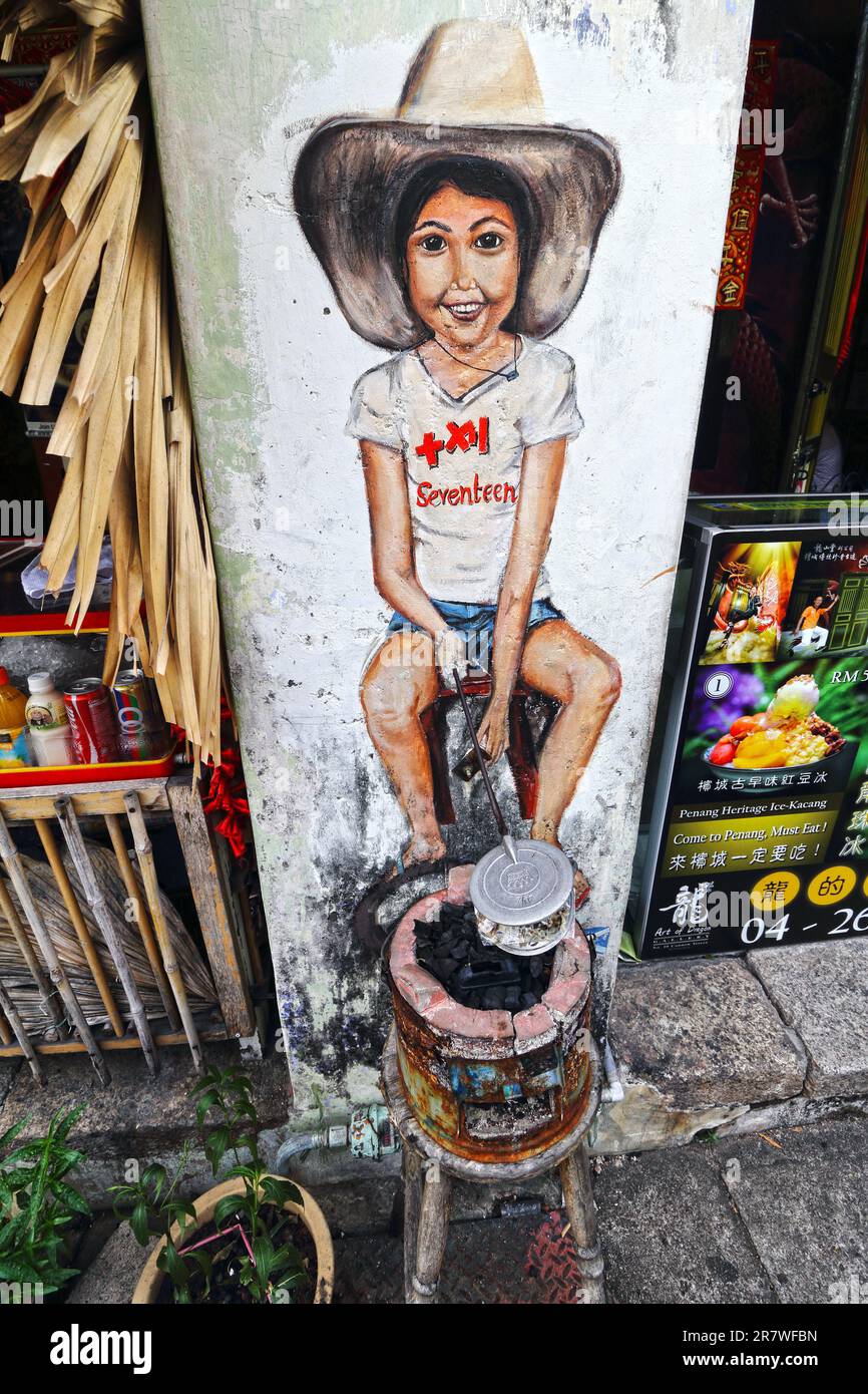 A vibrant painting of a young boy sitting on a stool Stock Photo - Alamy