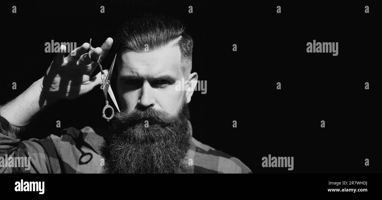 Hairdresser scissor. Bearded man, bearded male. Portrait of stylish man