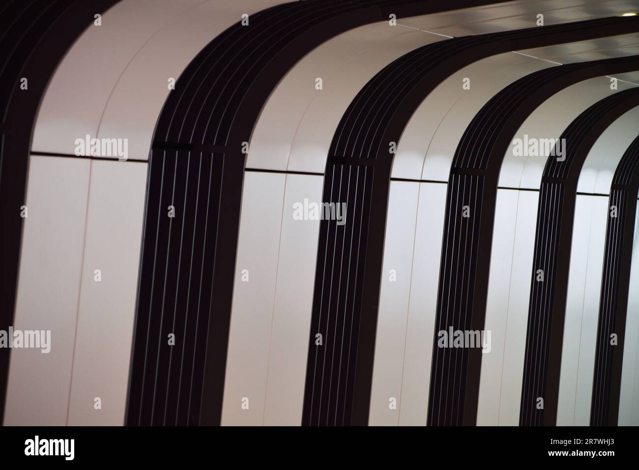 A black and white striped ceiling with vertical lines, creating a