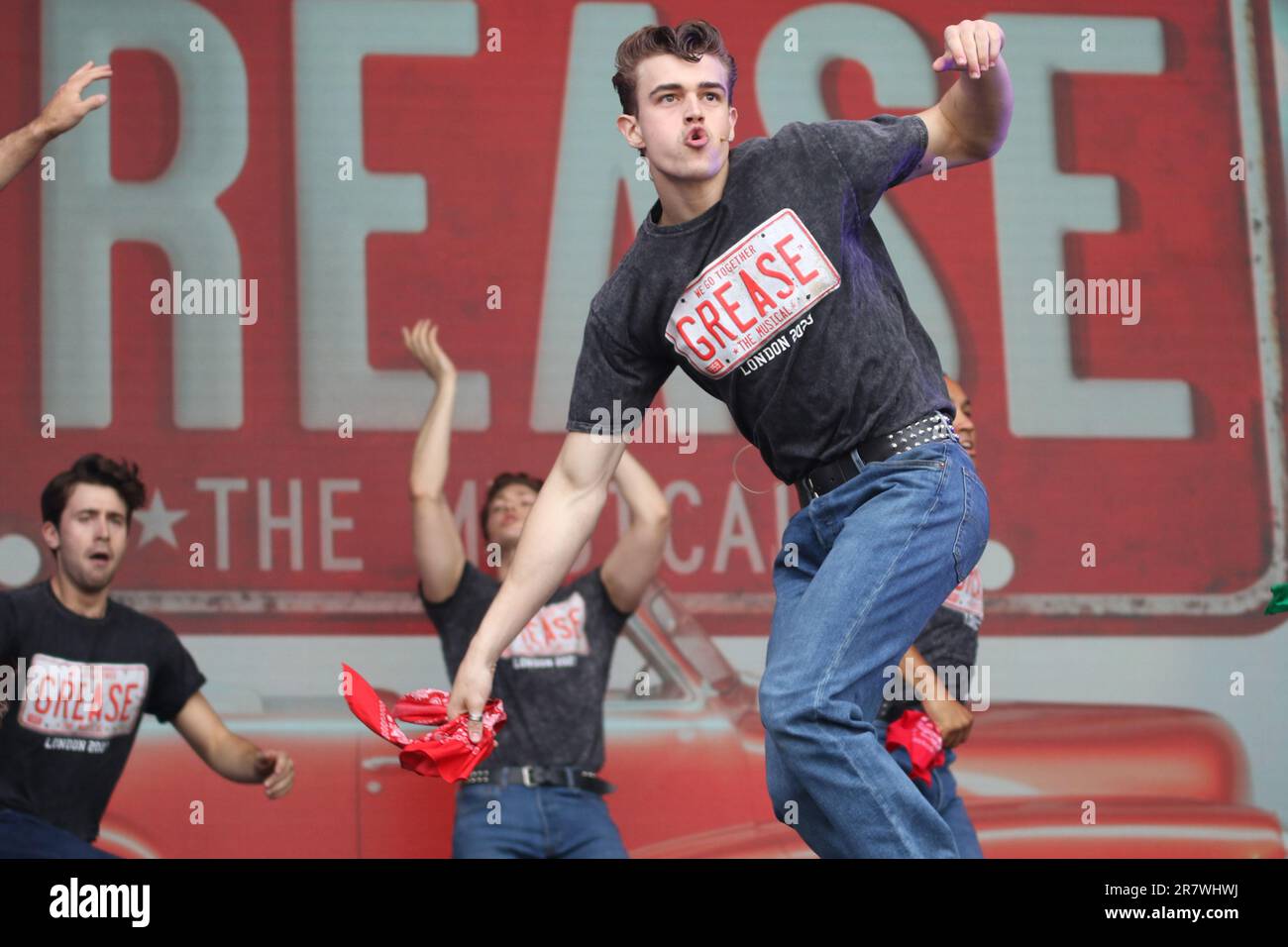The cast of the musical Grease perform live on stage at West End Live