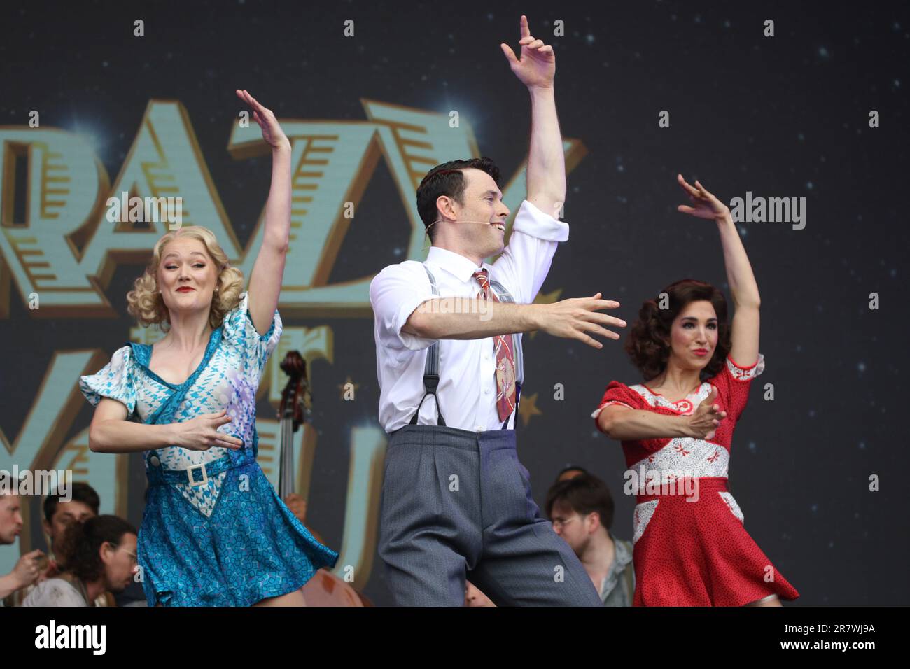 The cast of the musical Crazy for You perform live on stage at West End
