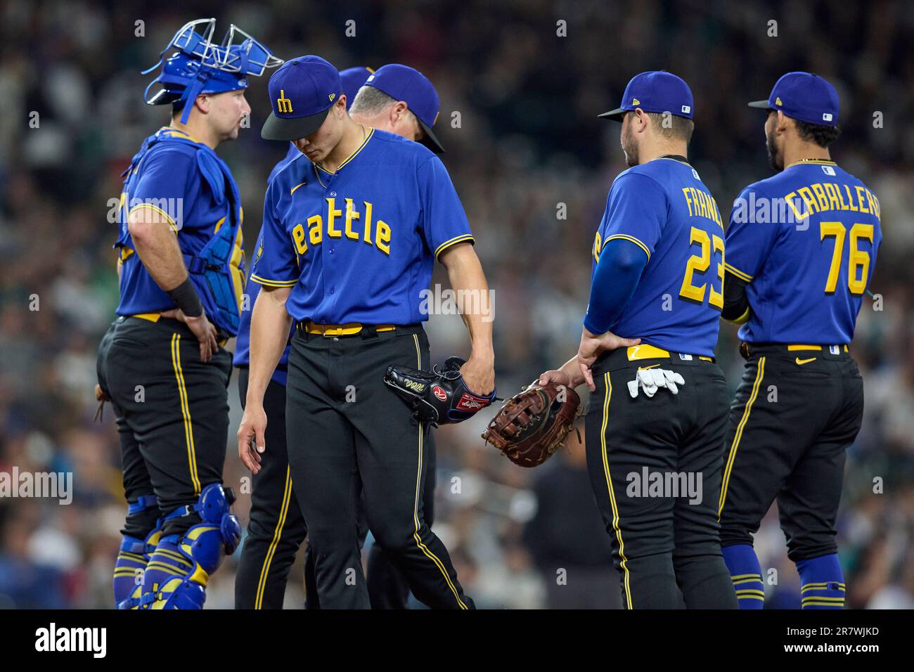 Seattle Mariners starting pitcher Bryan Woo walks off the mound as he