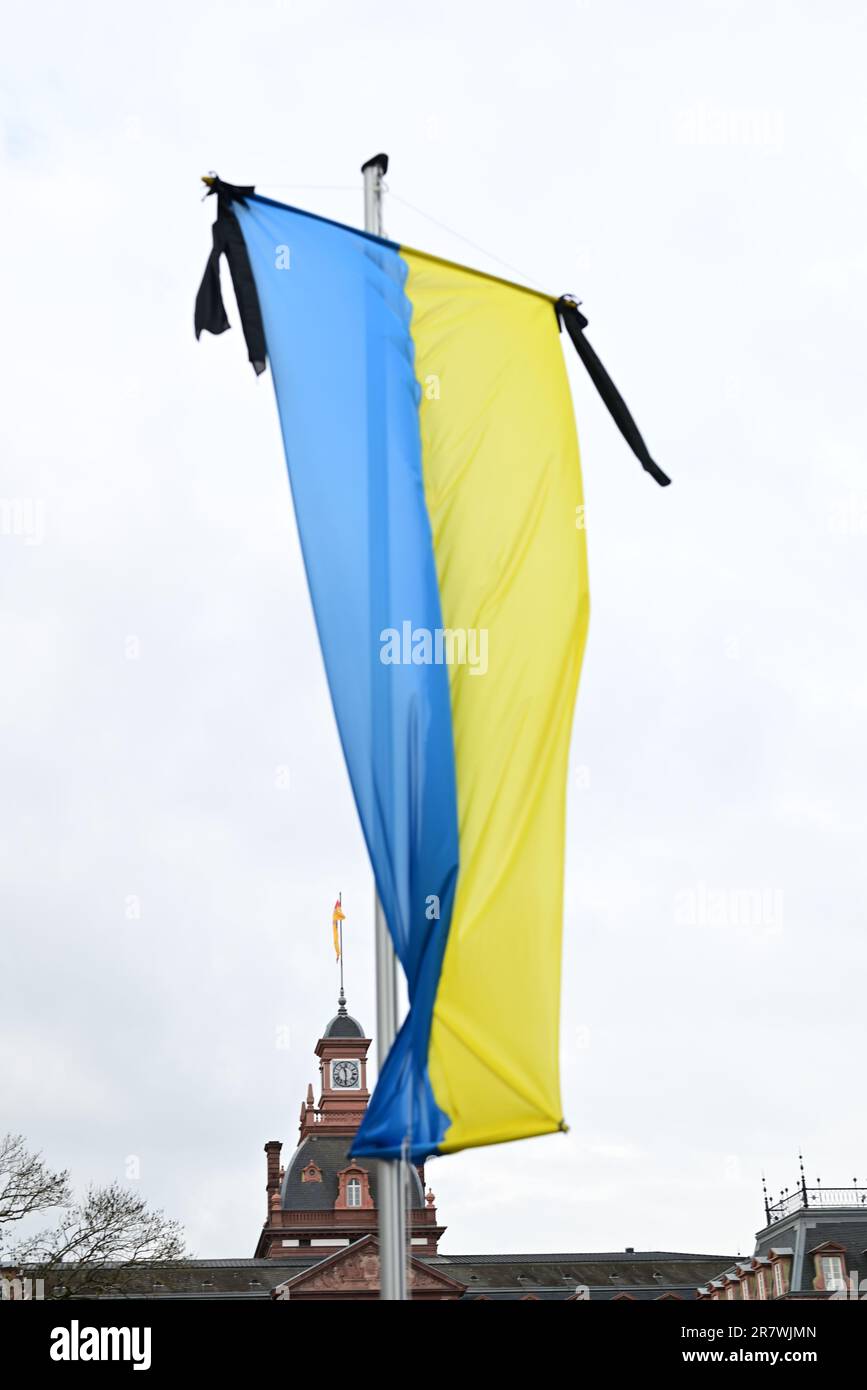 An image of a large Ukraine flag waving in the wind, mounted on a tall ...