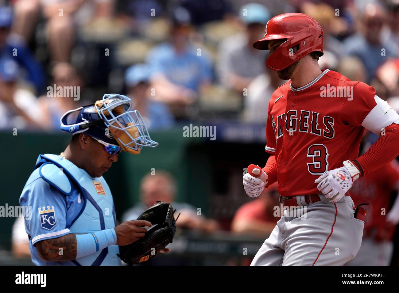 Los Angeles Angels' Taylor Ward (3) runs home past Kansas City Royals