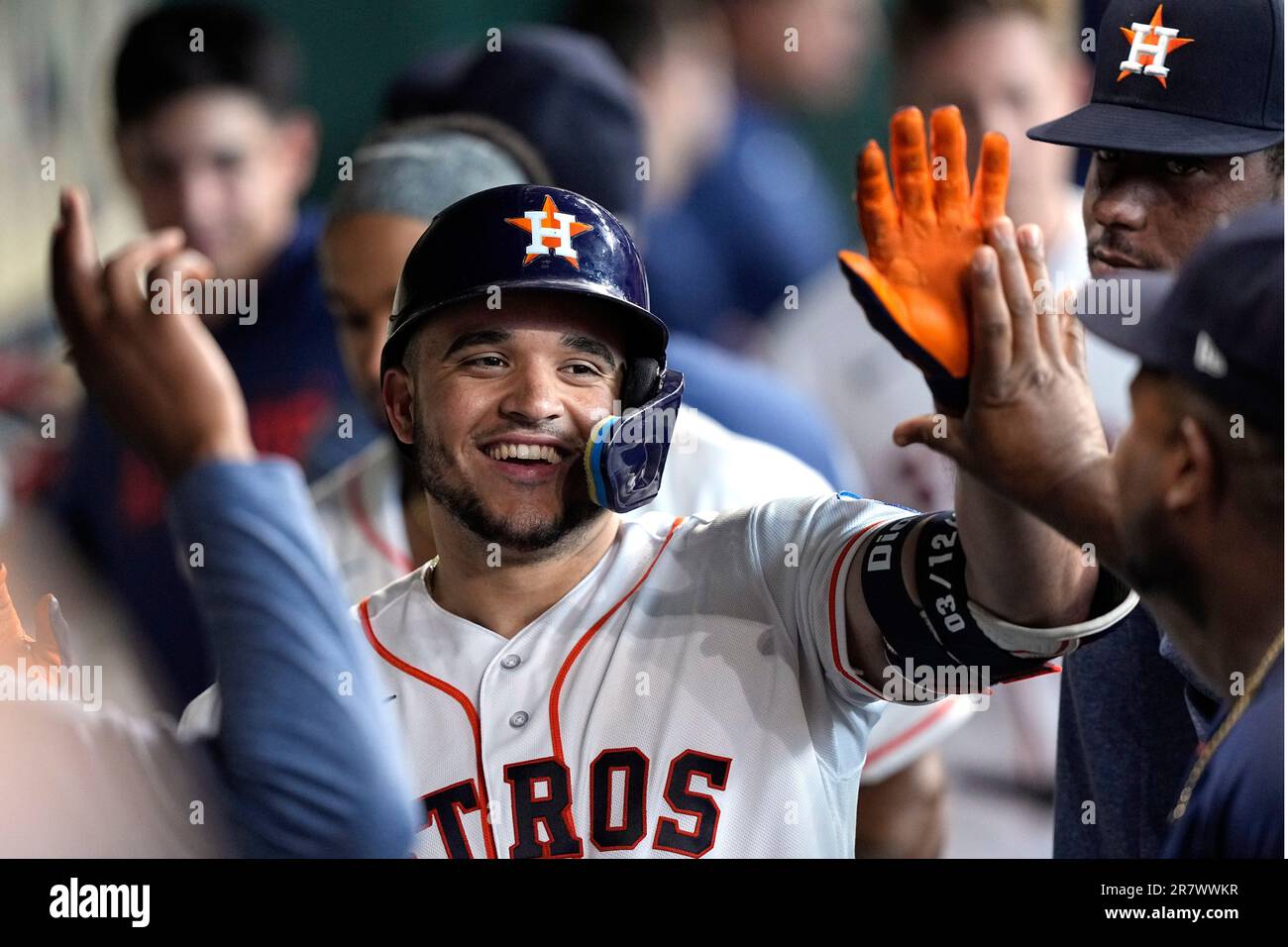 Houston Astros' Yainer Diaz celebrates in the dugout after hitting