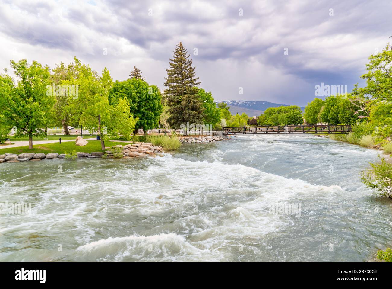 Park along the Riverwalk on the Truckee River in downtown Reno, California Stock Photo