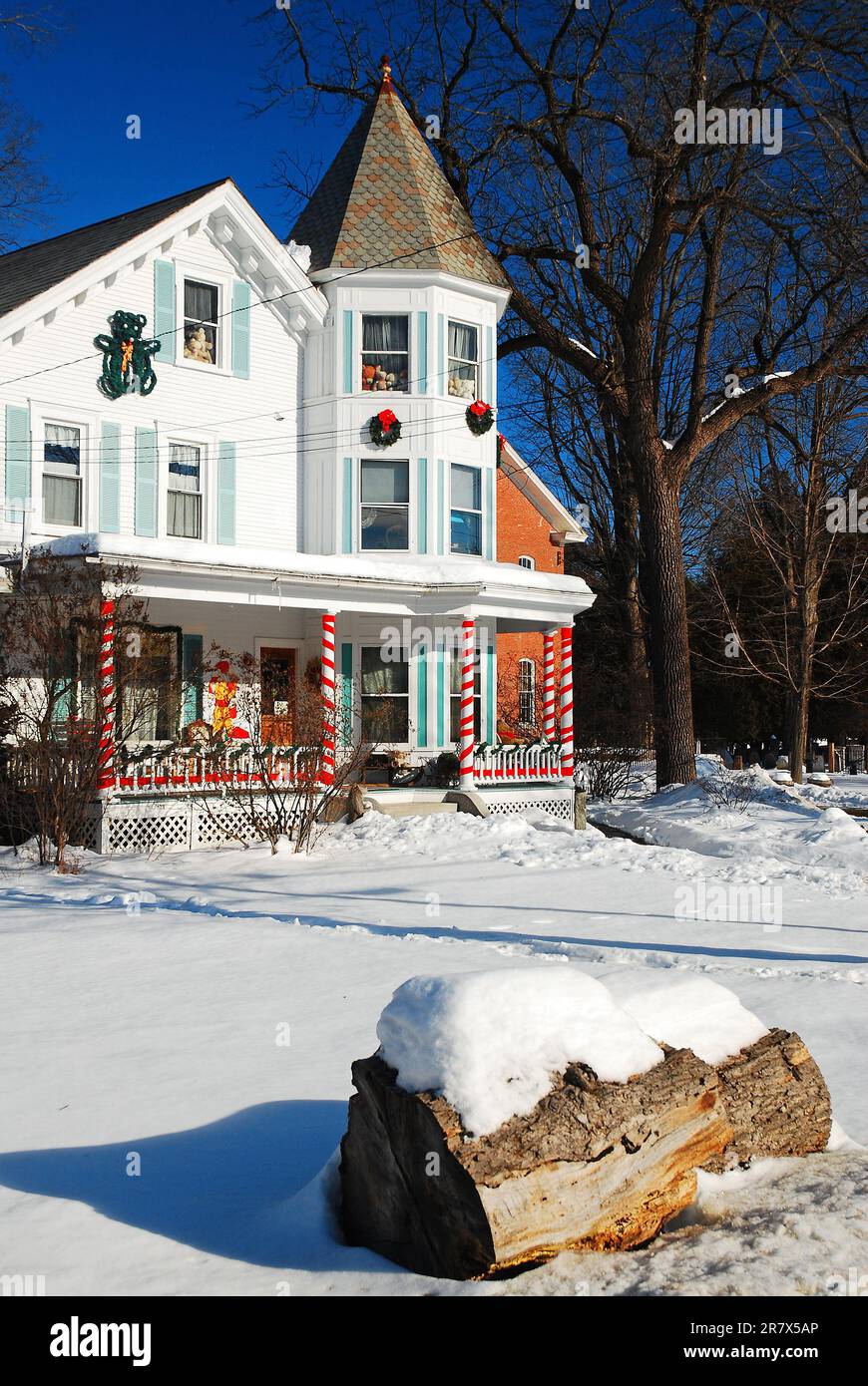 Snow surrounds a Victorian home decorated for Christmas in Vermont, New ...