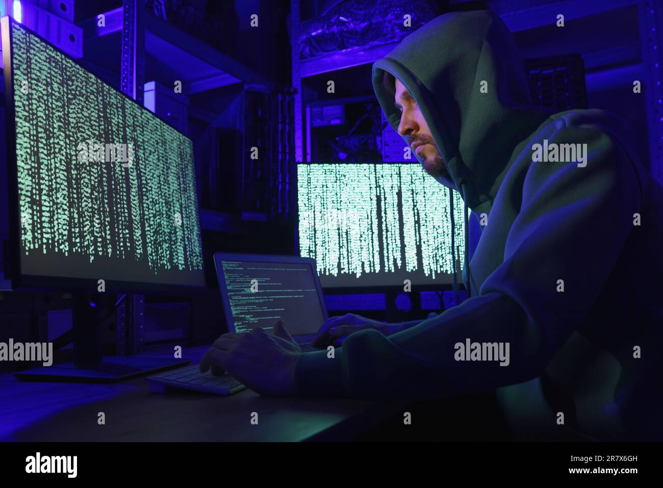 Hacker working with computers in dark room. Cyber attack Stock Photo