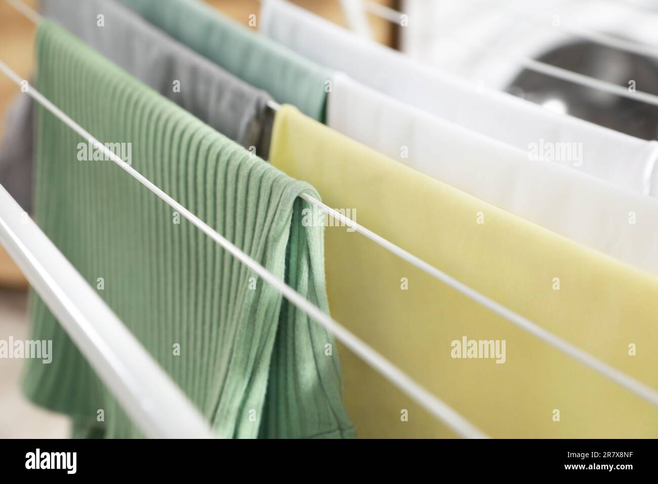 Different apparel drying on clothes airer, closeup Stock Photo Alamy