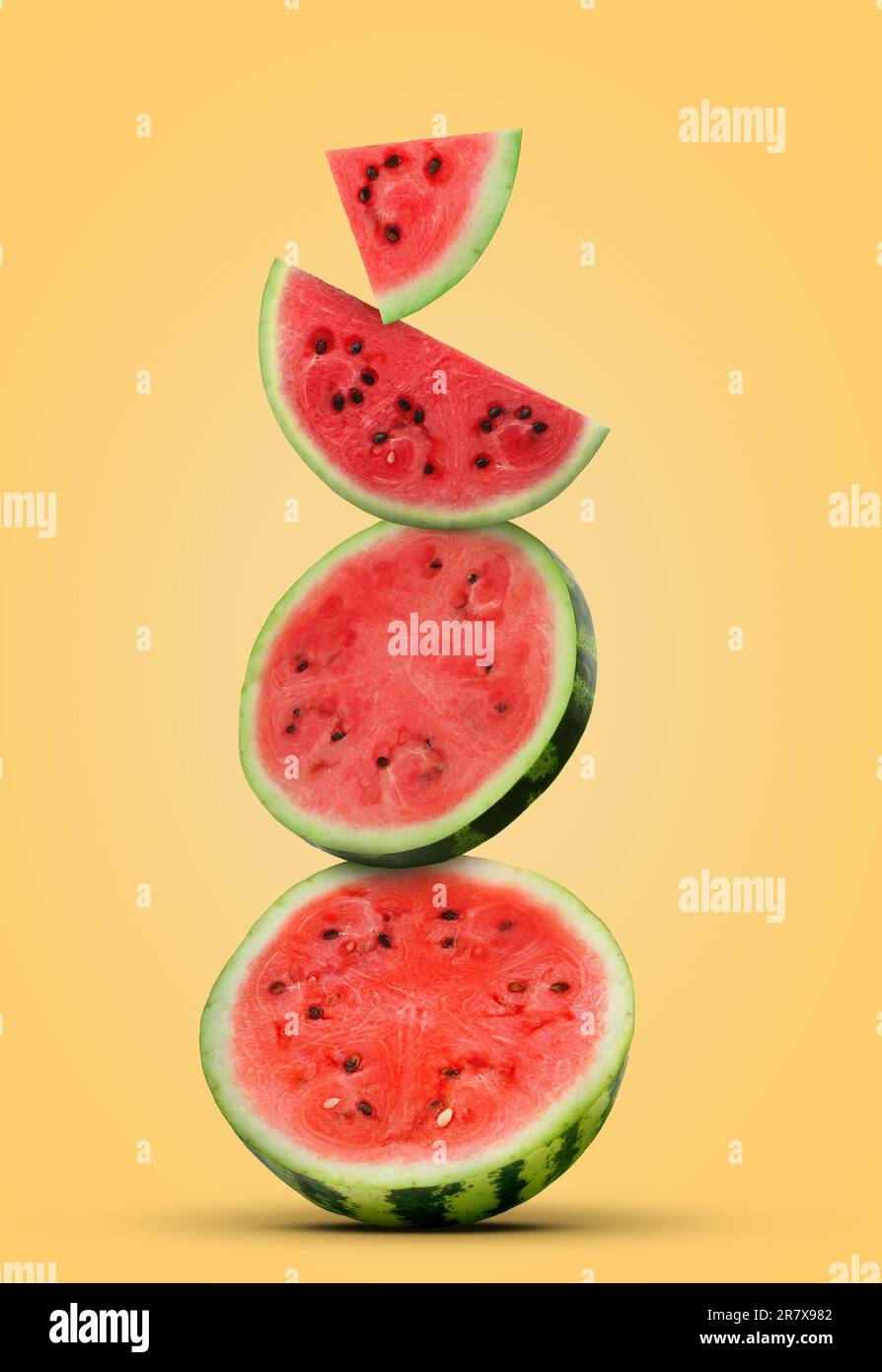 Stack of juicy watermelon slices on pastel gold background Stock Photo ...