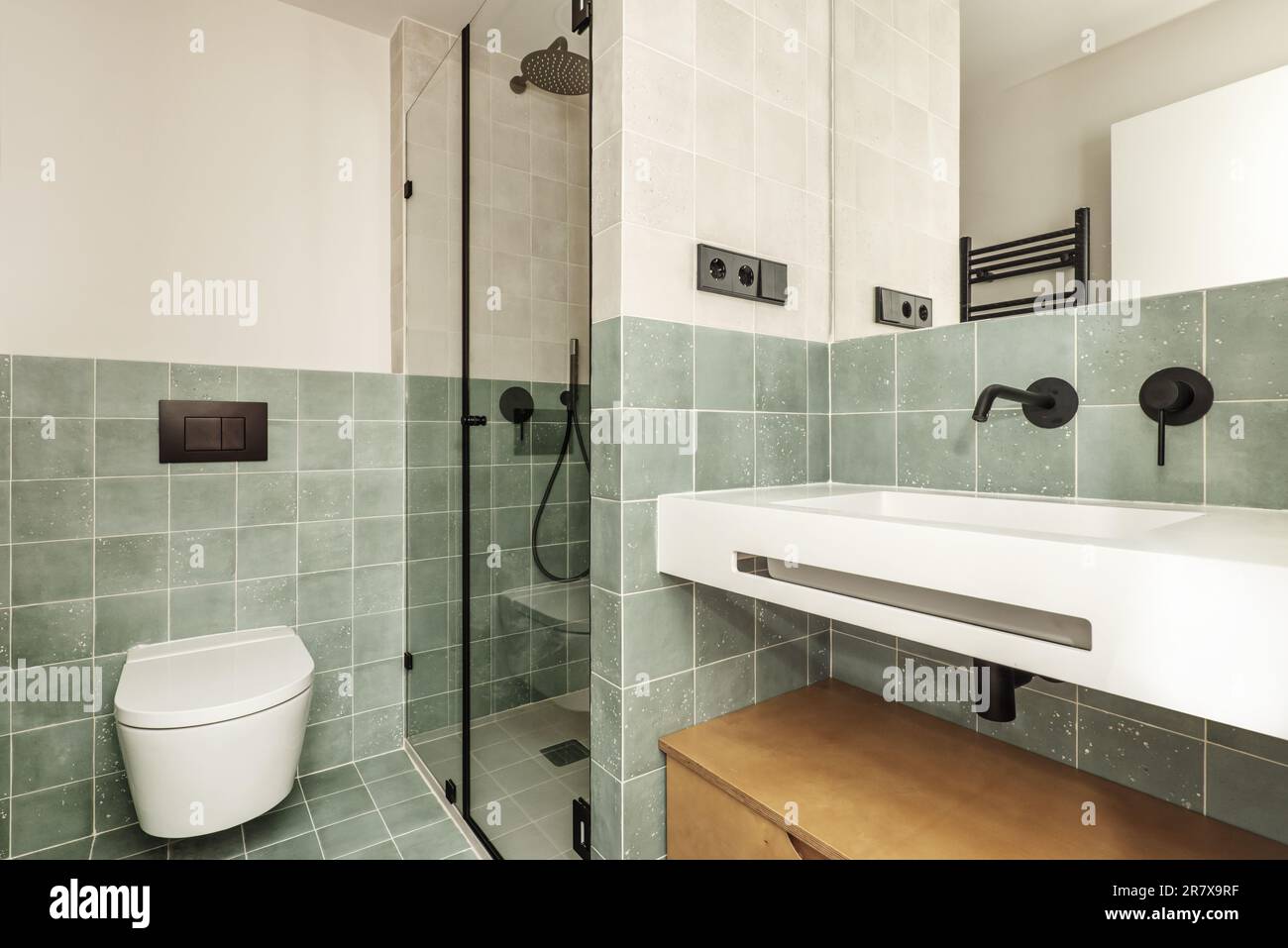 Bathroom of a house with contemporary decoration of small green tiles ...