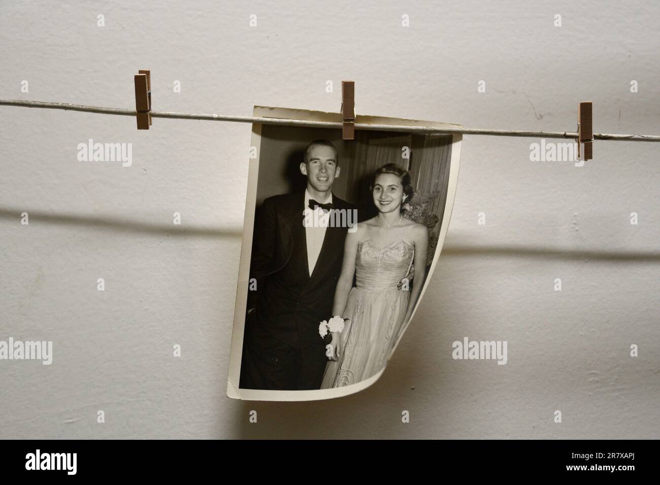 A 1950s prom portrait of a formally-dressed young American couple for sale in an antique shop. Stock Photo
