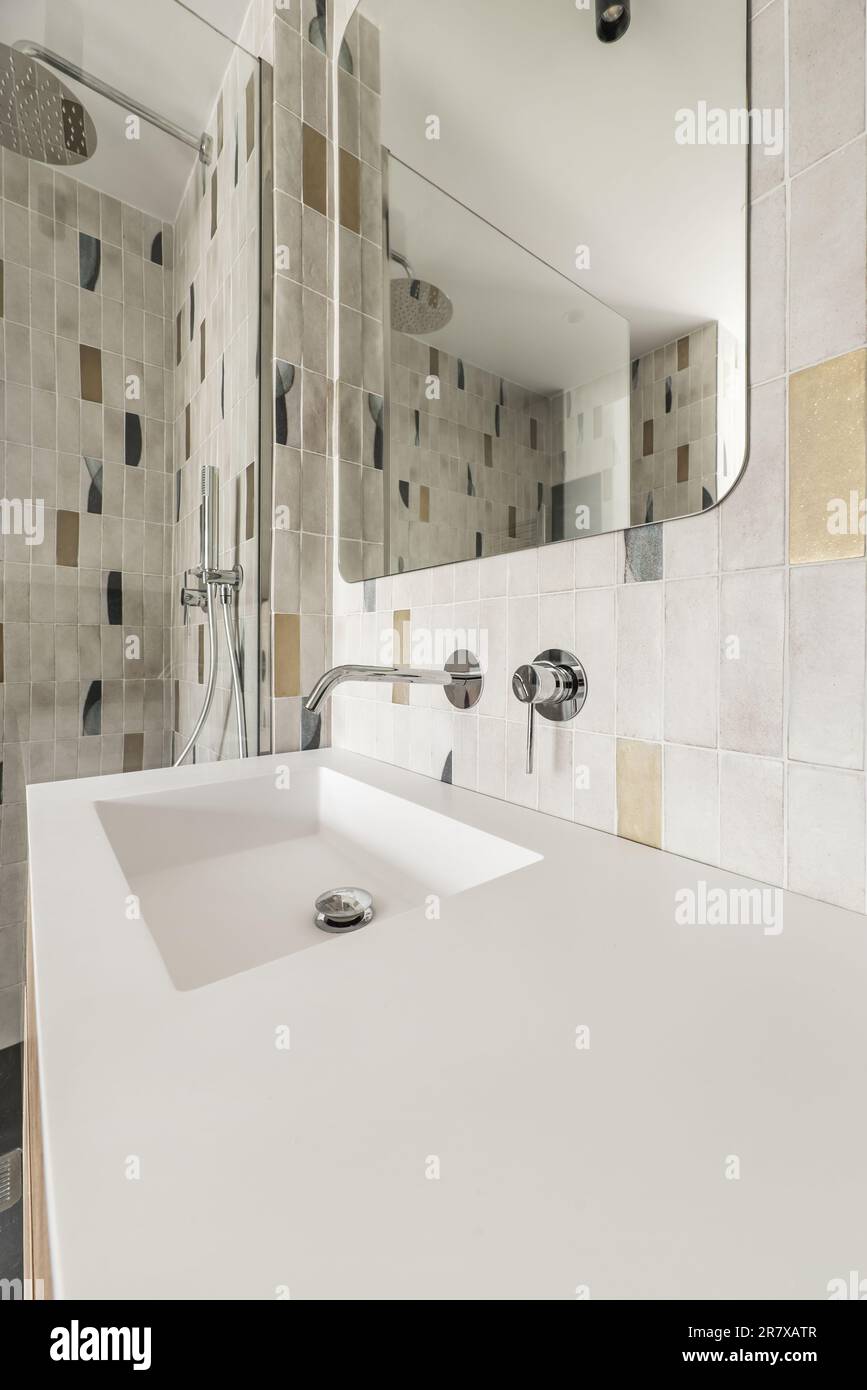 Modern bathroom with frameless mirror, onepiece white porcelain sink