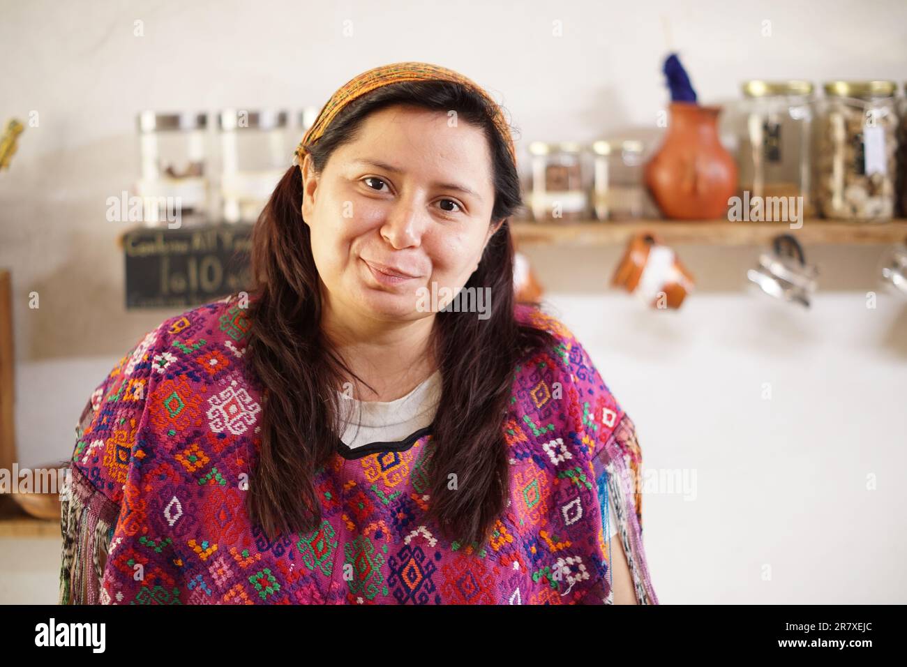 Smiling Guatemalan mayan woman in traditional huipil dress Stock Photo