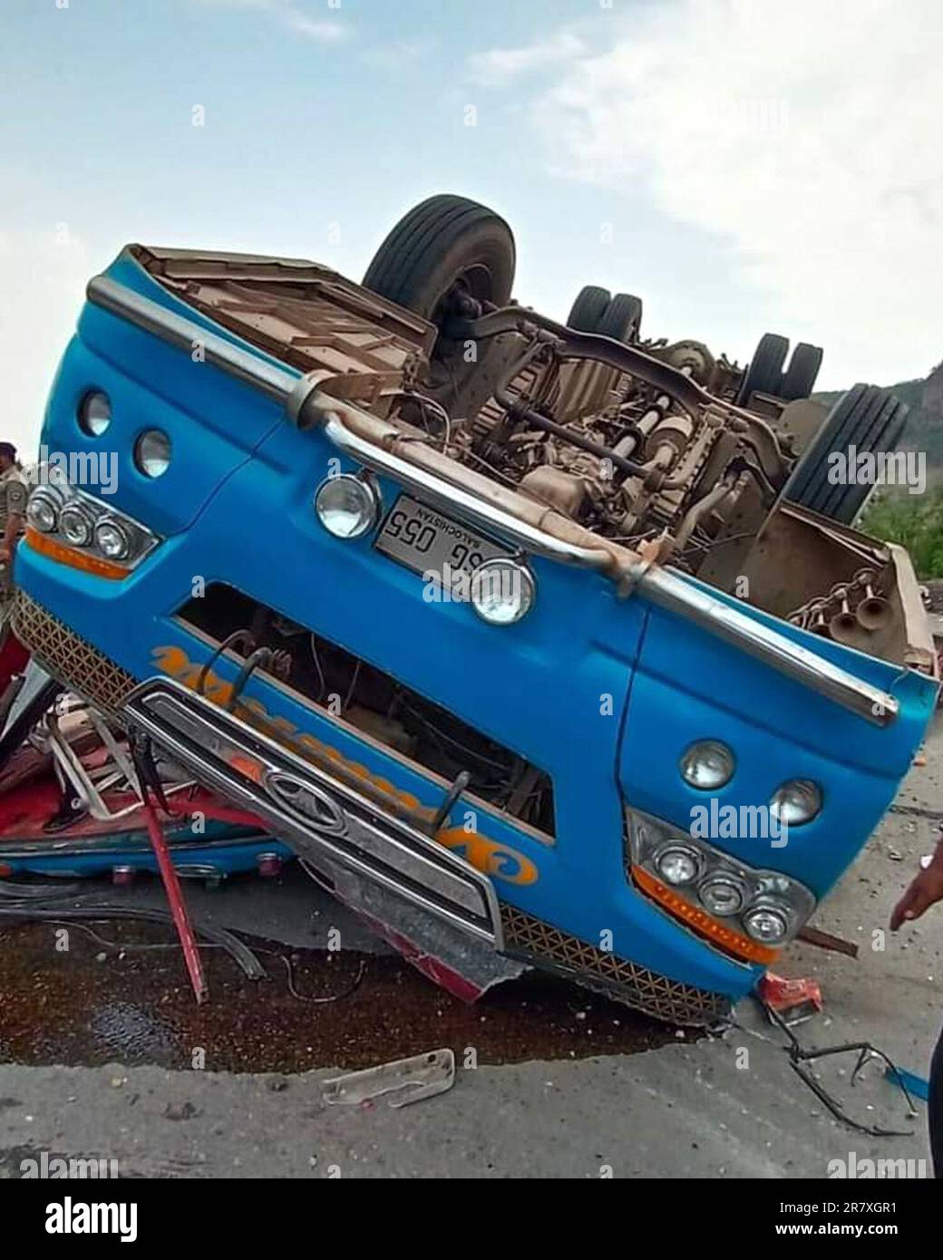 (230618) -- CHAKWAL, June 18, 2023 (Xinhua) -- An overturned passenger bus is pictured at a road accident site in Chakwal district of Pakistan's eastern Punjab province on June 17, 2023. At least 14 people were killed and over 20 others injured when a passenger bus turned turtle in Chakwal district of Pakistan's eastern Punjab province on Saturday, police officers said. The accident took place on the motorway near Kallar Kahar area of the district when the driver of the bus lost control of the vehicle due to brake failure, leading to the tragic crash, Deputy Inspector General of National Highw Stock Photo