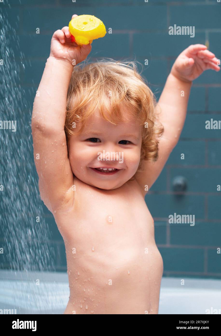 Kid shower. Baby showering. Portrait of kid bathing in a bath with foam Stock Photo Alamy