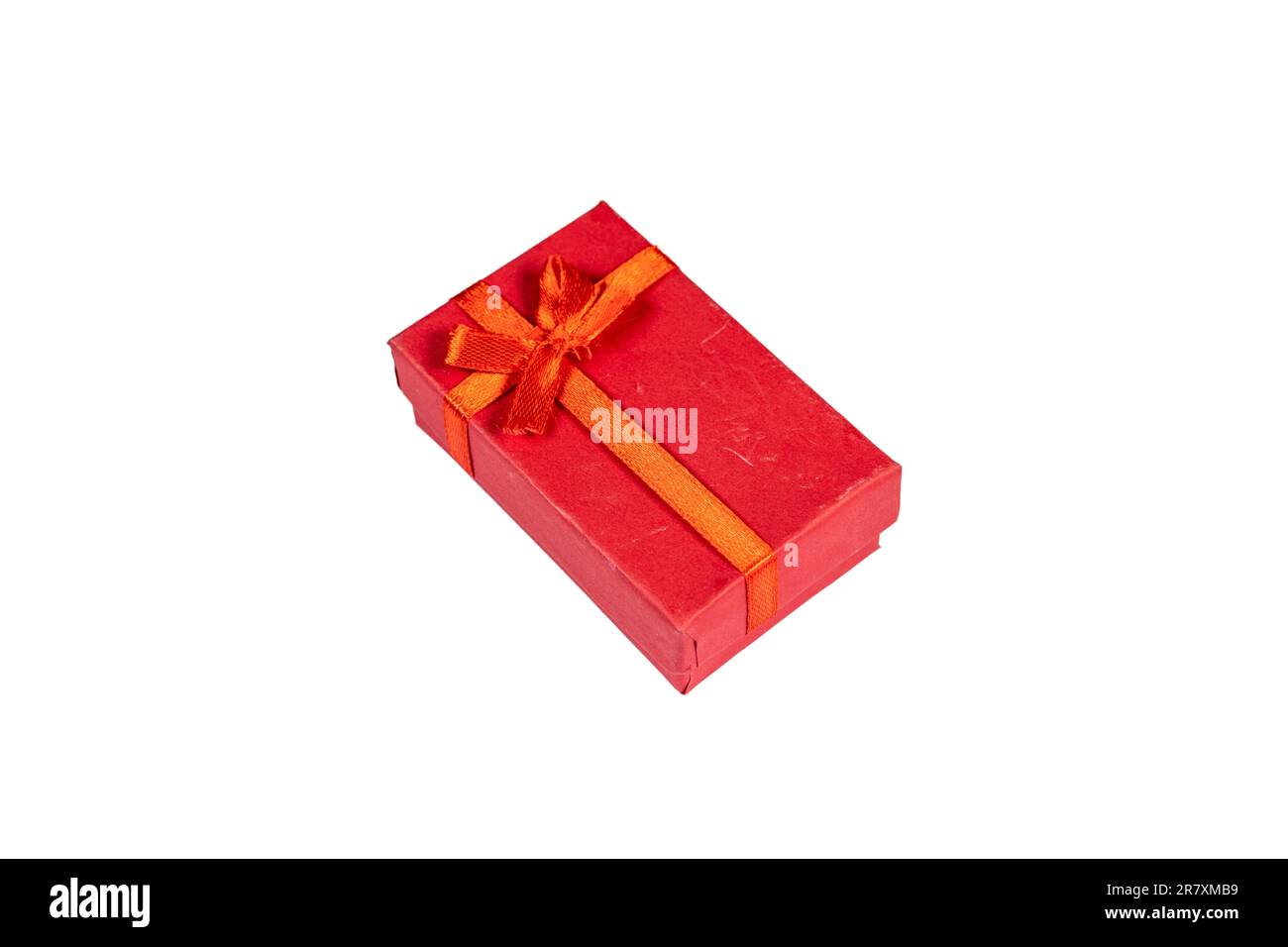 Red gift box with ribbon isolated on a white background Stock Photo - Alamy