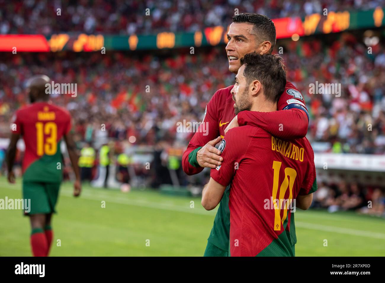 Lisbon, Portugal. 17th June, 2023. Cristiano Ronaldo and Bernardo Silva of Portugal celebrate a goal during the Euro 2024 qualifying match between Portugal and Bosnia Herzegovina at Estadio da Luz Stadium.Final score; Portugal 3:0 Bosnia Herzegovina. Credit: SOPA Images Limited/Alamy Live News Stock Photo