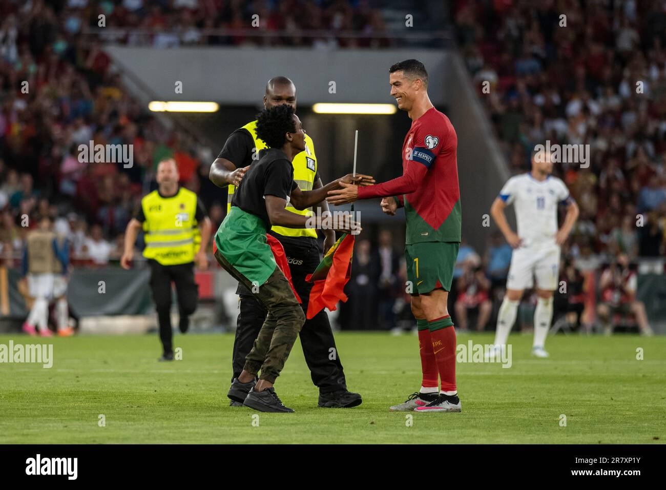 Lisbon, Portugal. 17th June, 2023. A fan is seen with Cristiano Ronaldo after invading the pitch during the Euro 2024 qualifying match between Portugal and Bosnia Herzegovina at Estadio da Luz Stadium.Final score; Portugal 3:0 Bosnia Herzegovina. Credit: SOPA Images Limited/Alamy Live News Stock Photo