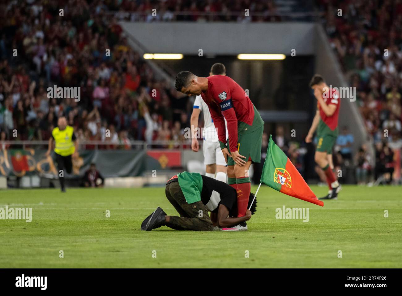 Lisbon, Portugal. 17th June, 2023. A fan is seen with Cristiano Ronaldo after invading the pitch during the Euro 2024 qualifying match between Portugal and Bosnia Herzegovina at Estadio da Luz Stadium.Final score; Portugal 3:0 Bosnia Herzegovina. Credit: SOPA Images Limited/Alamy Live News Stock Photo