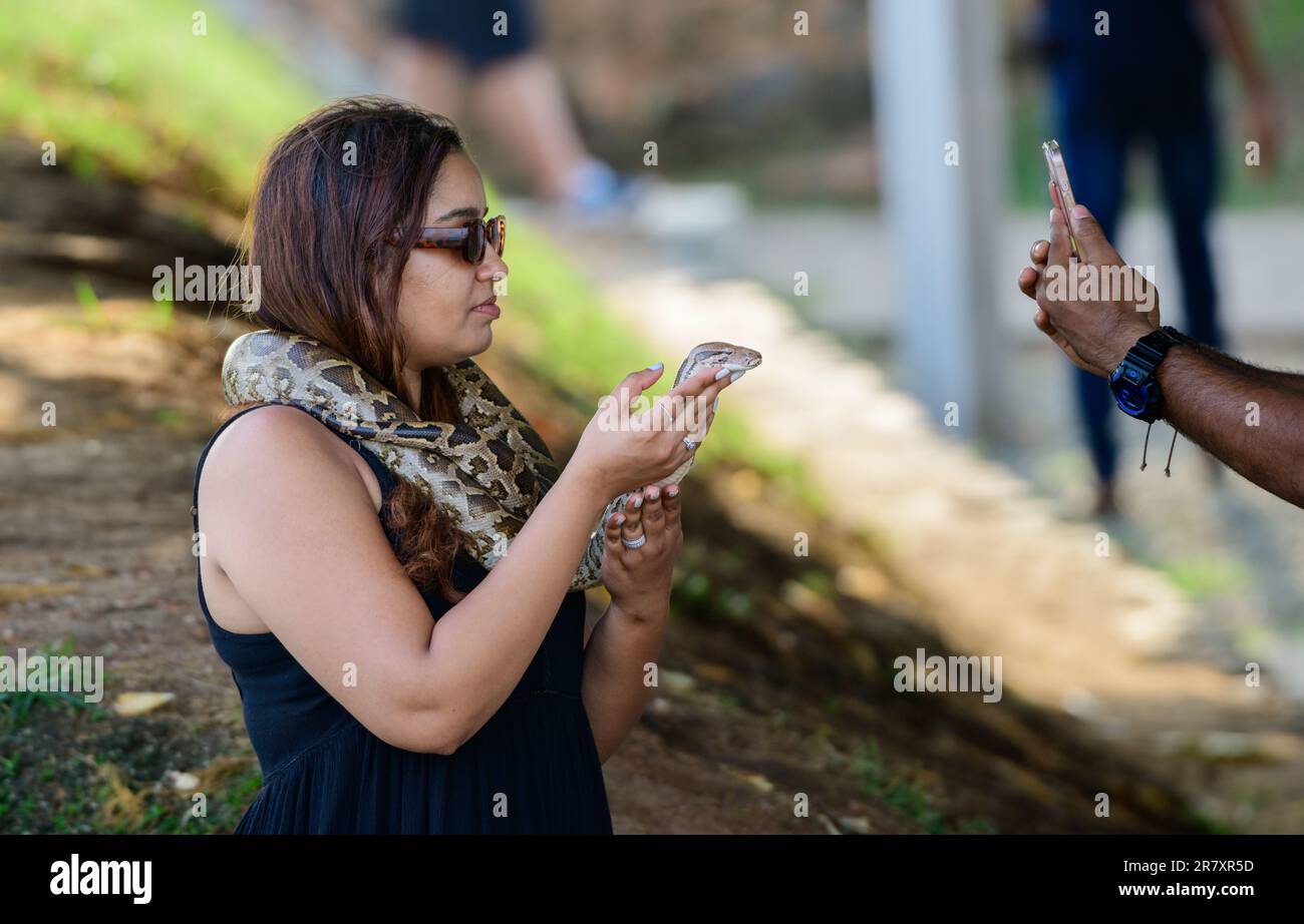 Woman with snake wrapped around her body Stock Photo - Alamy