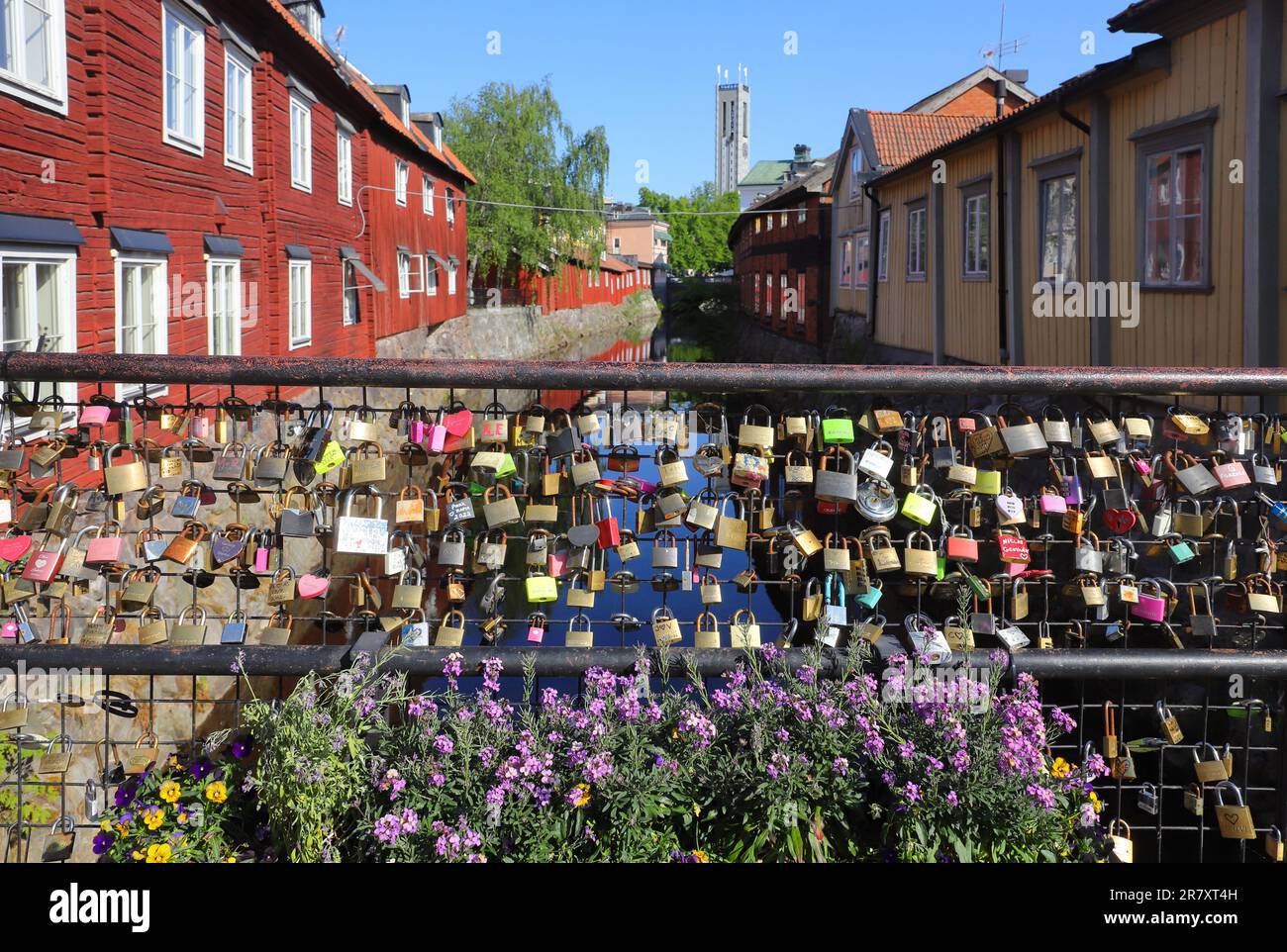 Vasteras, Sweden - June 9, 2023: Bridge railing with locked padlocks on Kungsgatan over the Svartan river. Stock Photo