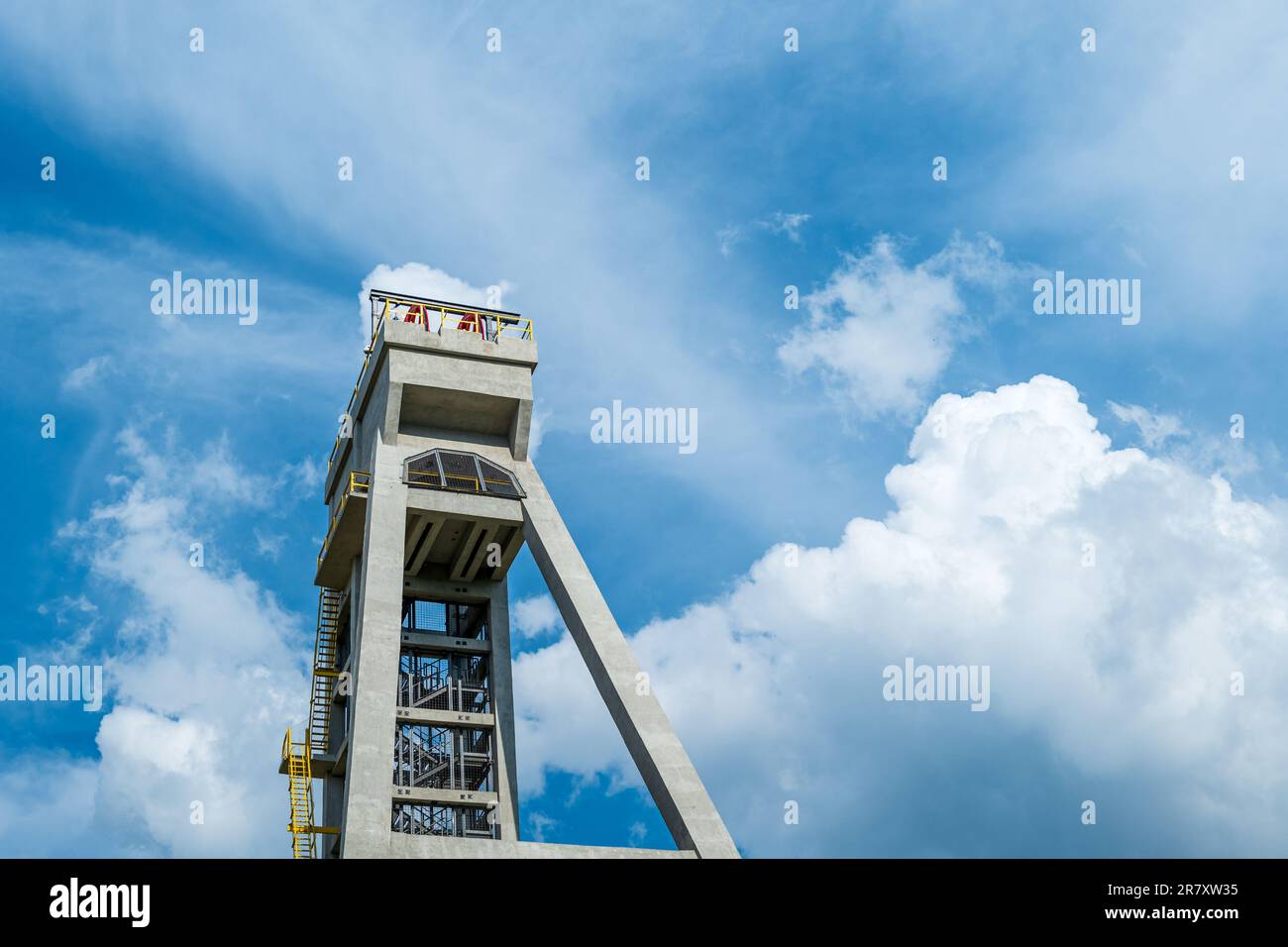 The tower of the former mine shaft against the blue sky. Currently an observation tower. Shaft President, Chorzow, Poland Stock Photo