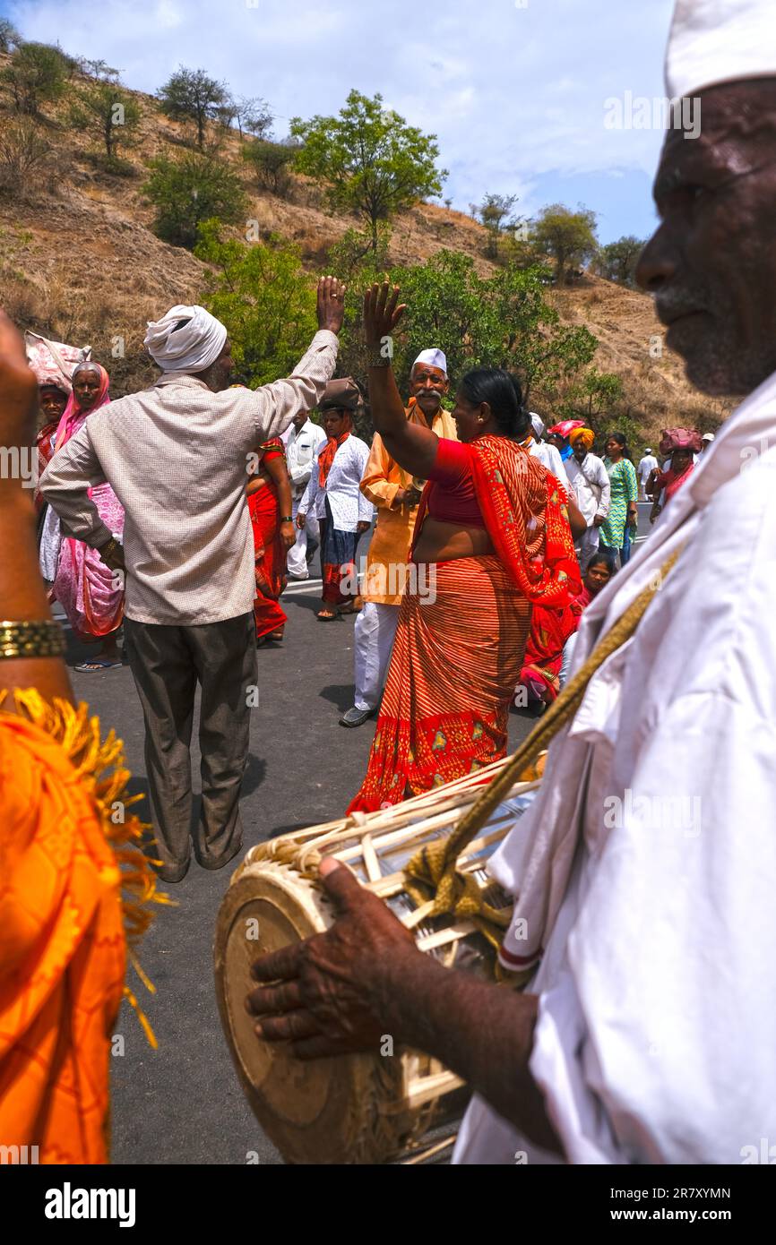 Pune, India 14 July 2023, cheerful Pilgrims at Palkhi, During Pandharpur wari procession Pilgrims marching toward Vitthala temple with singing. Stock Photo