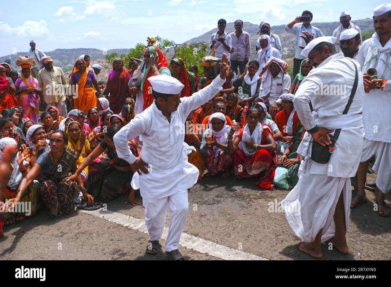 Pune, India 14 July 2023, cheerful Pilgrims at Palkhi, During Pandharpur wari procession Pilgrims marching toward Vitthala temple with singing. Stock Photo