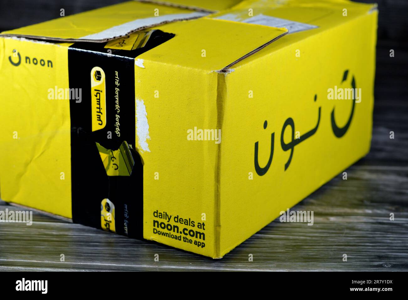 Cairo, Egypt, June 12 2023 Noon online shopping delivery yellow box