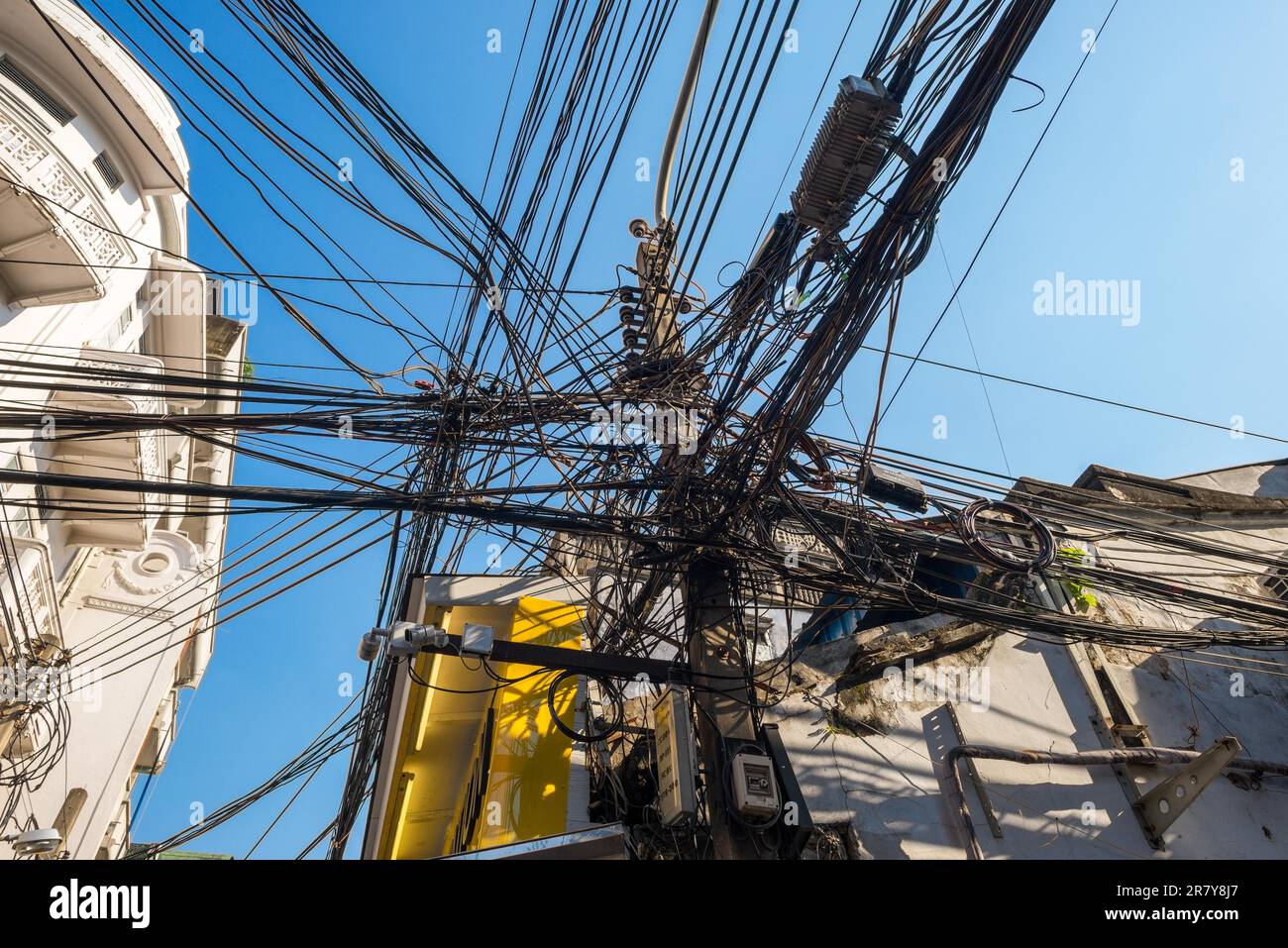 Power Line Insteetrs Pylon for overhead power lines in the streets of Chinatown in the ...