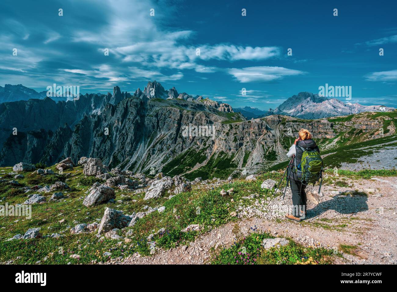 Backpacker on hiking trails in the Dolomites, Italy Stock Photo