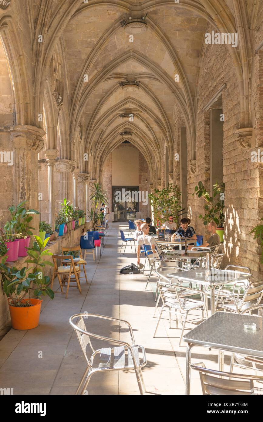 The Bar is in the backyard of an old convent. In the former monastery is also a library and parts of the University of Barcelona. The cafeteria is Stock Photo