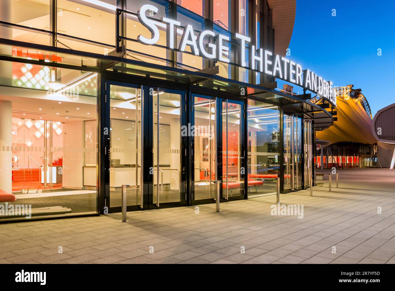 There are two musical theater directly opposite the St. Pauli landing stages. World famous music and plays are performed. It is a main attraction for Stock Photo