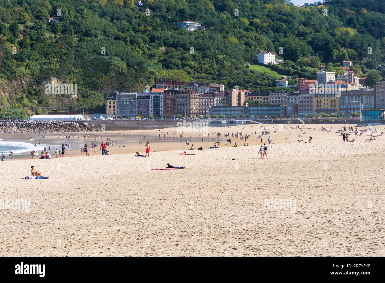 The beach la Zurriola in Donostia San Sebastian. The beach, situated at the district Gros of Donostia is famous for surfing, sports and relaxing Stock Photo