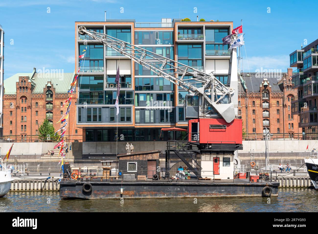 Sophisticated multi-storey house in the HafenCity Hamburg. In the back the world heritage site, the Speicherstadt Stock Photo