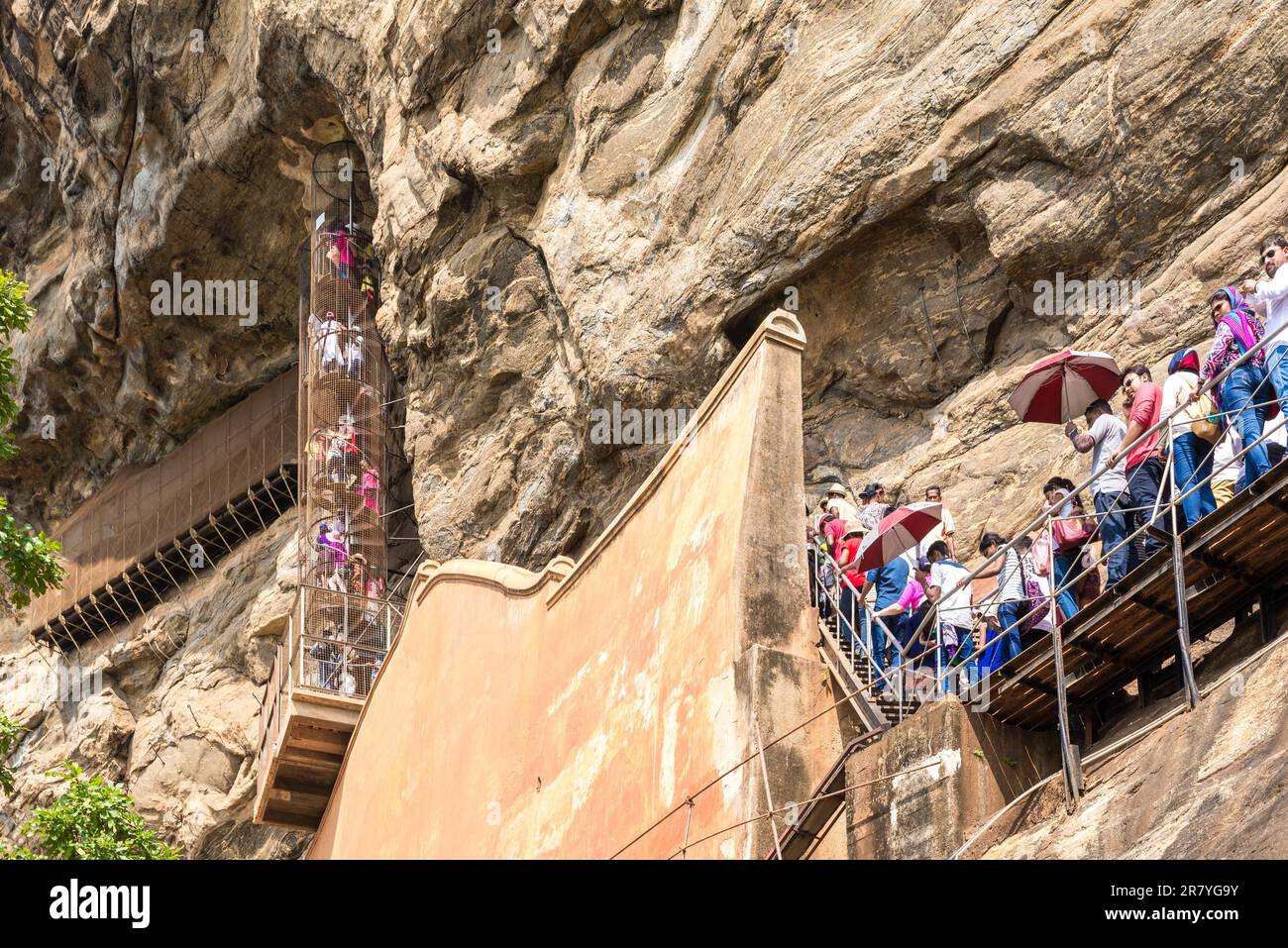 People climb up stairs and spiral stairs that leads to the cave with the famous frescoes Stock Photo