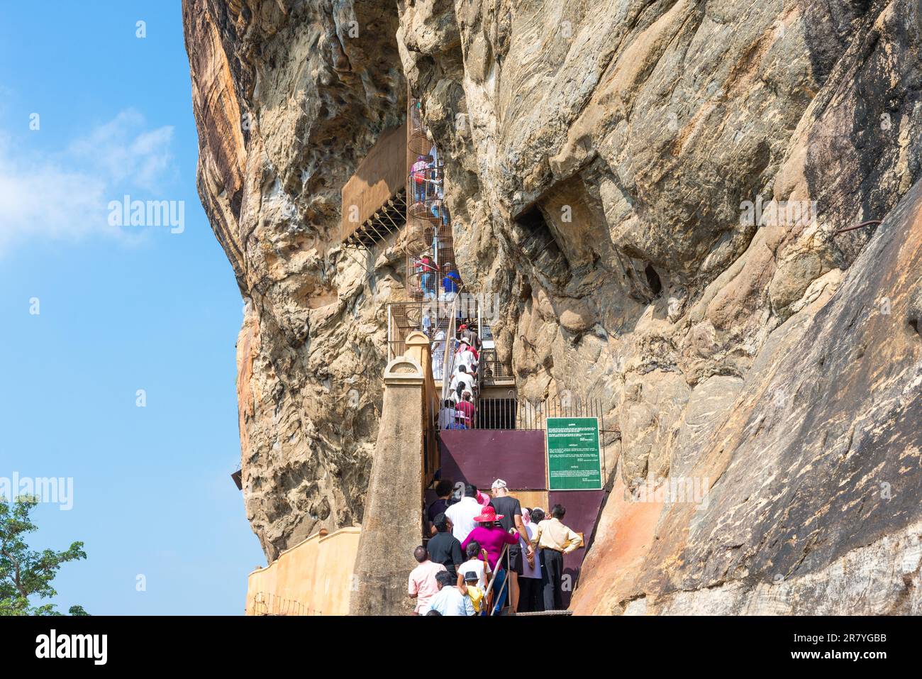 People climb up stairs and spiral stairs that leads to the cave with the famous frescoes Stock Photo