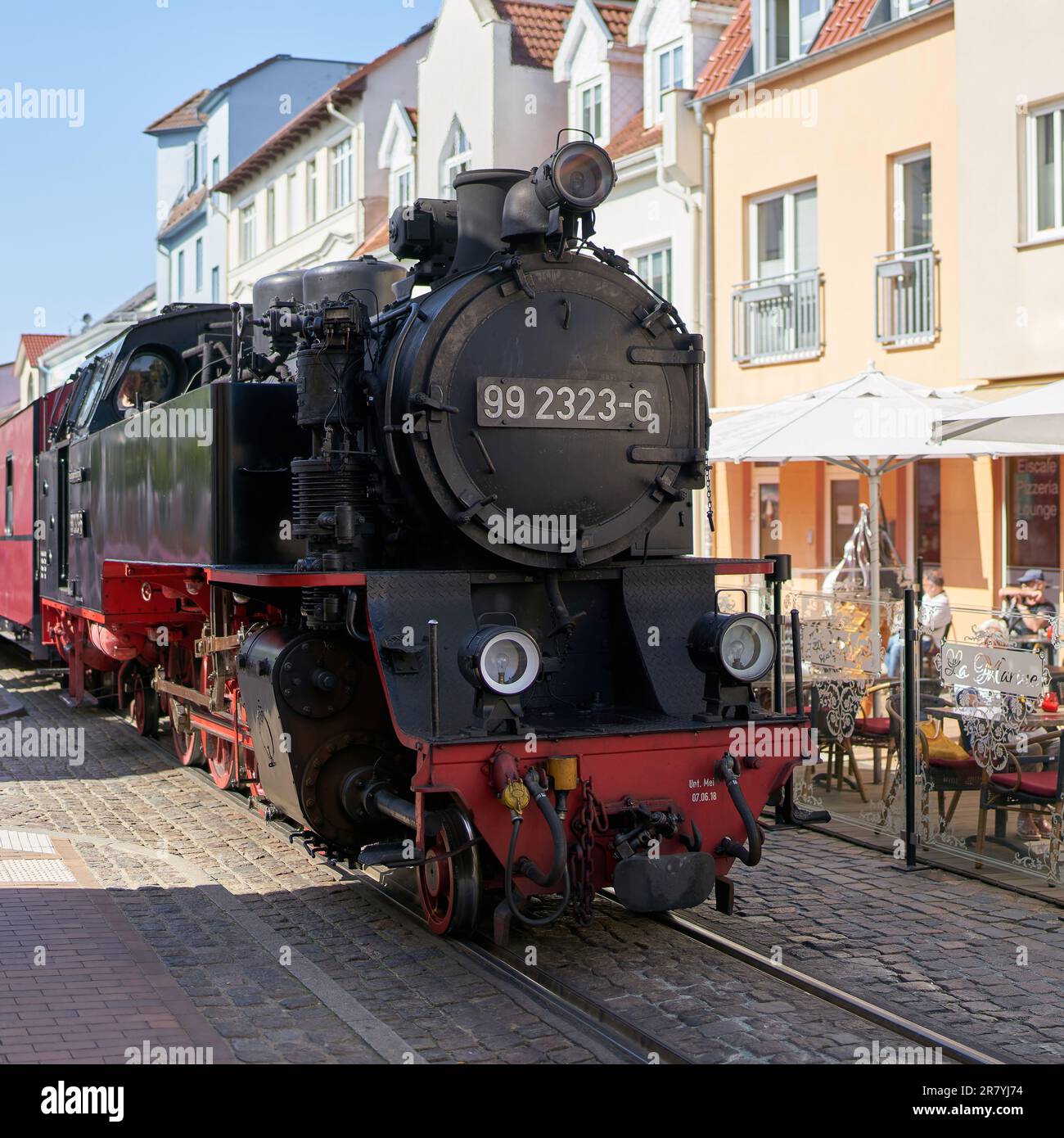 Passenger train of the tourist train Molli during your journey through the old town of Bad Doberan at the German Baltic Sea Stock Photo