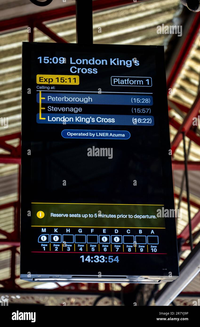 Train Station, Grantham, Lincolnshire, UK – Passenger information screen showing departure to London Kings Cross Stock Photo