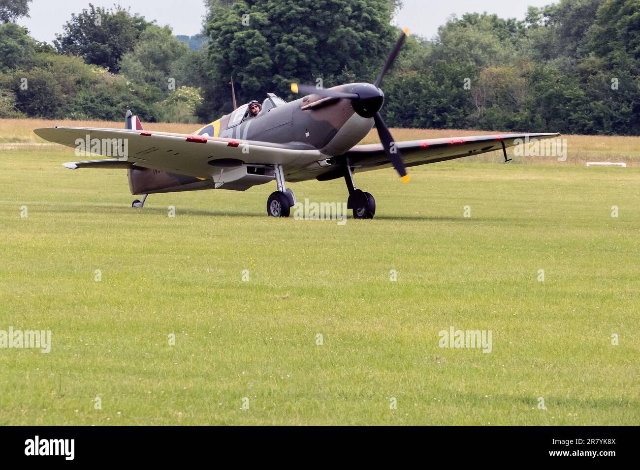 Second World War Warbird Spitfire MK1 arrive at 2023 Bicester Flywheel event, staged at Bicester Heritage UK Stock Photo