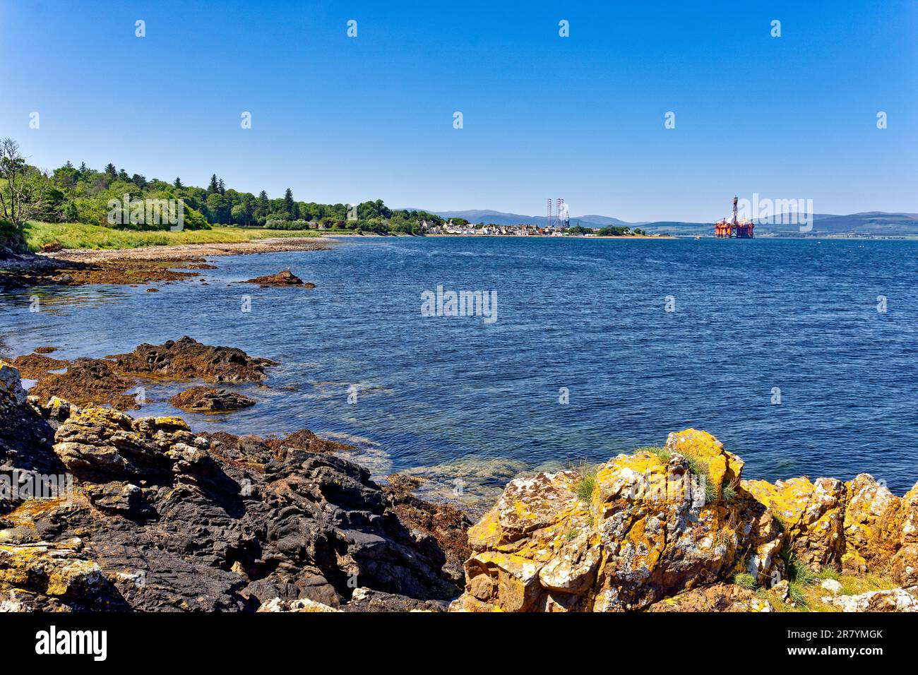Cromarty Scotland Cromarty Firth blue sky and looking across to Cromarty from the shore of South Sutor in early summer Stock Photo
