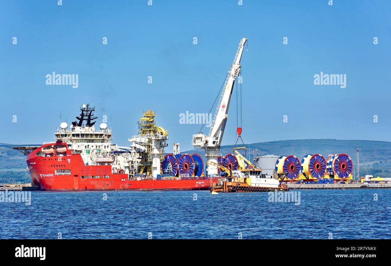 Nigg Scotland the Deep Explorer Diving Support and Construction Vessel and blue and red cable reels Stock Photo
