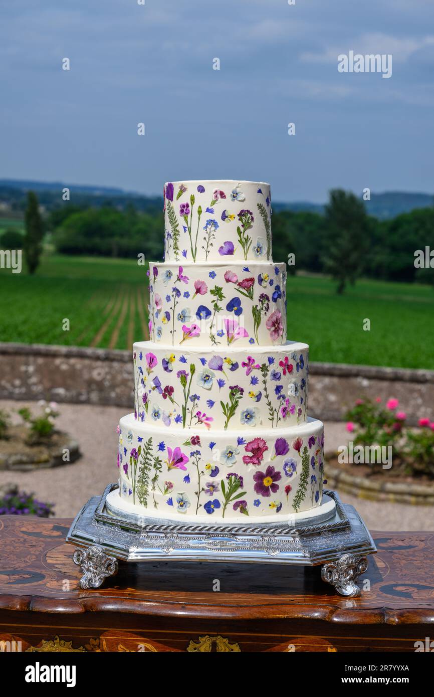 Four tier wedding cake with pressed flowers Stock Photo