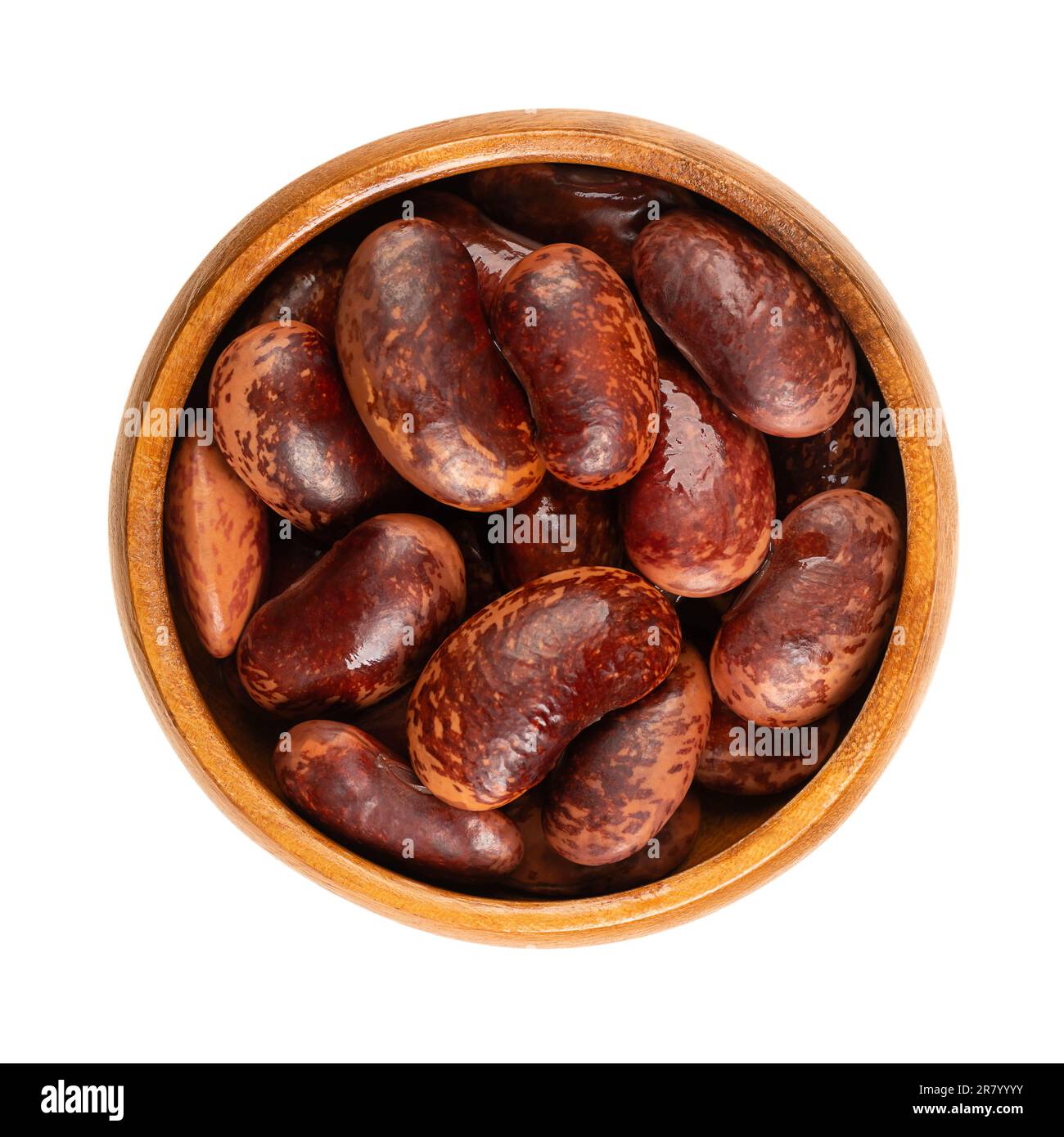 Scarlet Runner beans in a wooden bowl. Boiled and canned runner beans, seeds of Phaseolus coccineus, also known as multiflora or butter bean. Stock Photo
