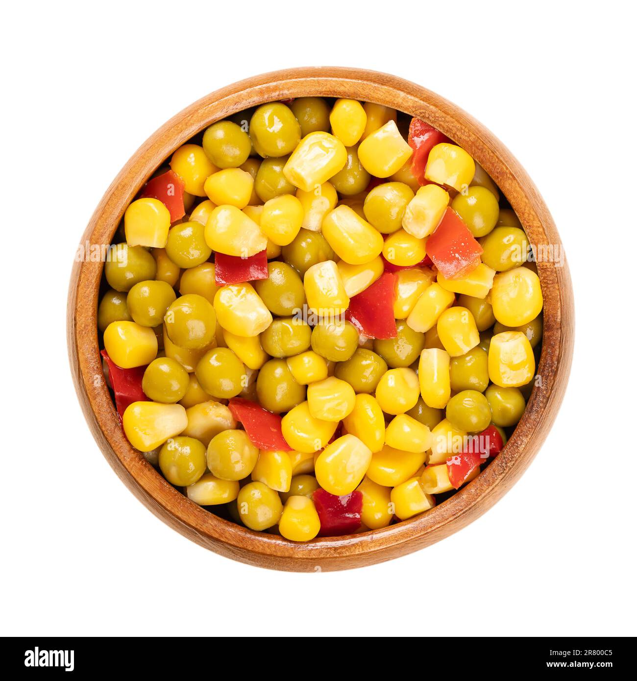 Mix of canned corn, green peas and diced red bell pepper, in a wooden bowl. Ready to eat Mexican maize mix, as a side dish to a barbecue. Stock Photo