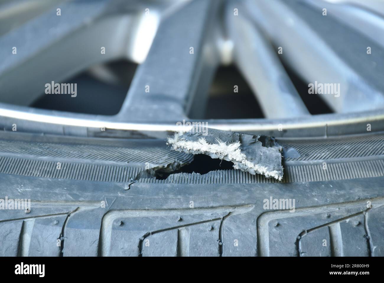 broken tire on magnesium alloy wheel from accident Stock Photo Alamy